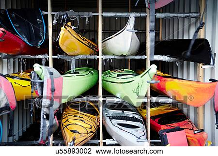Kayaks stacked in cubes View Large Photo Image Stock Image - Kayaks stacked in cubes. Fotosearch