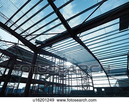 Low angle view of steel construction frame on building site View Large Photo Image Stock Photo - Low angle view of steel construction frame on building site. Fotosearch