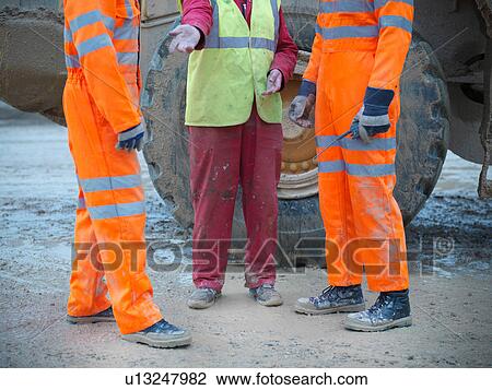 Low section view of workmen in onsite discussion on quarry site View Large Photo Image Stock Image - Low section view of workmen in onsite discussion on quarry site. Fotosearch