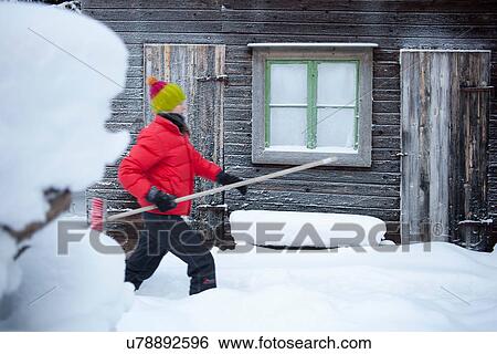 Man carrying broom on snowy path View Large Photo Image Stock Photograph - Man carrying broom on snowy path. Fotosearch