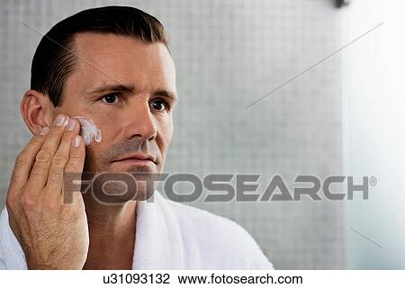 Man lathering shaving cream on face View Large Photo Image Stock Image - Man lathering shaving cream on face. Fotosearch