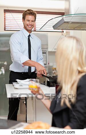 Man making breakfast for girlfriend View Large Photo Image Picture - Man making breakfast for girlfriend. Fotosearch