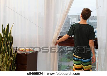 Man opening curtains View Large Photo Image Stock Image - Man opening curtains. Fotosearch