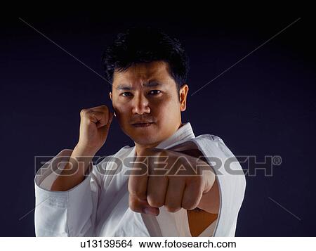 Picture - Man practicing martial arts. Fotosearch
