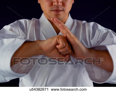 Man practicing martial arts View Large Photo Image Stock Image - Man practicing martial arts. Fotosearch