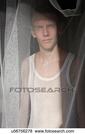 Man standing behind sheer curtain View Large Photo Image Stock Photo - Man standing behind sheer curtain. Fotosearch