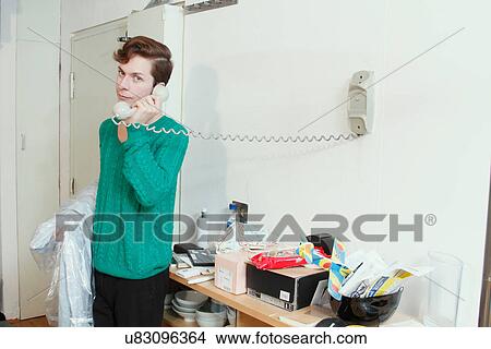 Picture - Man talking on telephone. Fotosearch