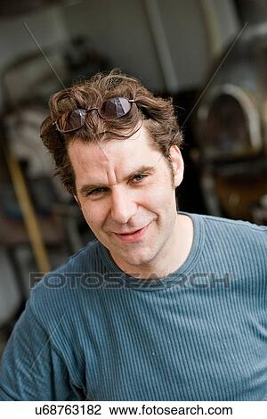 Man wearing glasses on his head View Large Photo Image Stock Image - Man wearing glasses on his head. Fotosearch