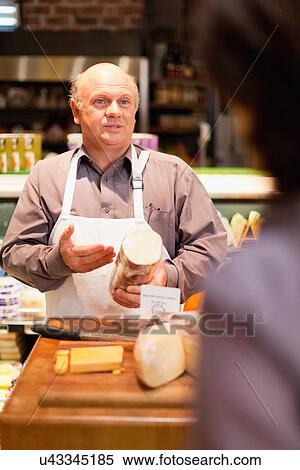 Man with free samples in grocery store View Large Photo Image Stock Photography - Man with free samples in grocery store. Fotosearch