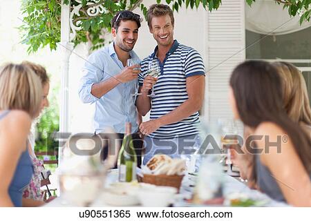 Men having wine at table outdoors View Large Photo Image Stock Photography - Men having wine at table outdoors. Fotosearch