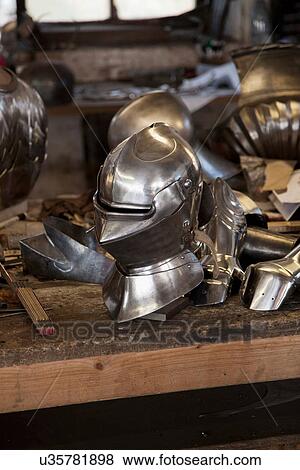 Metal helmet in blacksmith's shop View Large Photo Image Stock Photo - Metal helmet in blacksmith's shop. Fotosearch