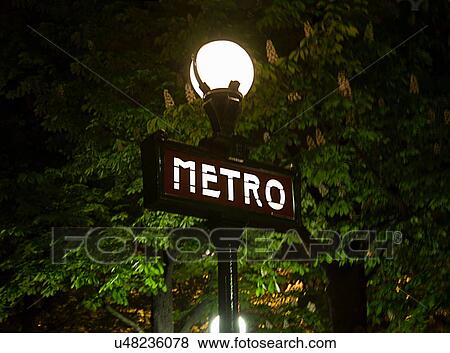 Stock Photo - Metro sign on streetlight in Paris. Fotosearch