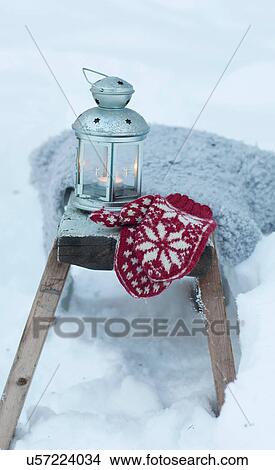 Mittens and lantern in snowy field View Large Photo Image Picture - Mittens and lantern in snowy field. Fotosearch