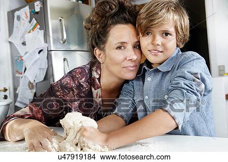 Picture - Mother and son baking in kitchen. Fotosearch