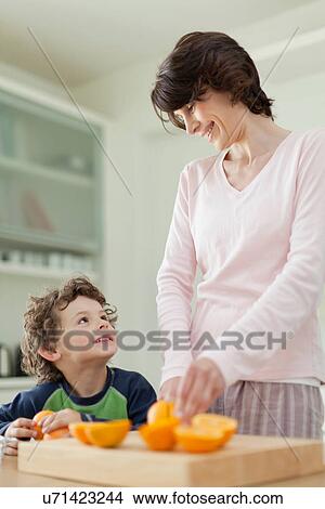Mother and son having breakfast View Large Photo Image Picture - Mother and son having breakfast. Fotosearch