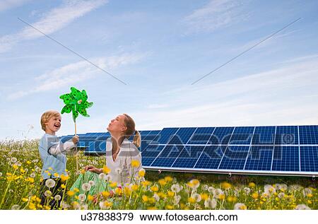 Mother and son with solar panels View Large Photo Image Stock Photo - Mother and son with solar panels. Fotosearch