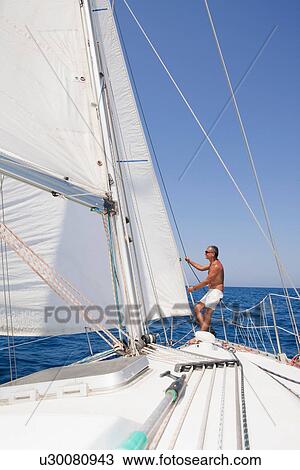 Older man sailing on lake View Large Photo Image Stock Image - Older man sailing on lake. Fotosearch