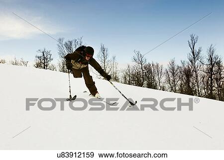Stock Photo - One-legged skier snowy slope. Fotosearch