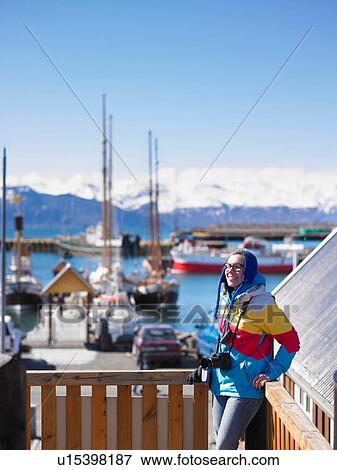 Photographer standing on wooden dock View Large Photo Image Stock Photo - Photographer standing on wooden dock. Fotosearch