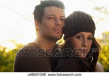 Stock Photo - Portrait of couple in autumn sunlight. Fotosearch