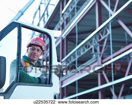 Portrait of workman by van and steel construction frame on building site View Large Photo Image Stock Image - Portrait of workman by van and steel construction frame on building site. Fotosearch