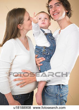 Pregnant mother with husband and child View Large Photo Image Stock Photo - Pregnant mother with husband and child. Fotosearch