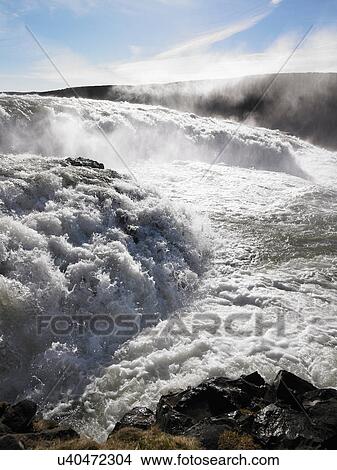Picture - River rushing over rocks. Fotosearch