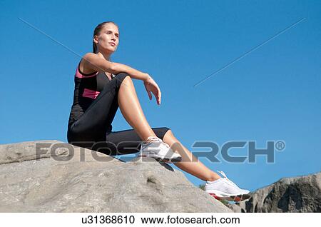 Rock climber resting on boulder View Large Photo Image Stock Image - Rock climber resting on boulder. Fotosearch