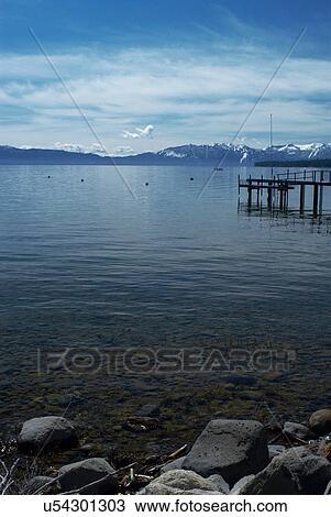 Stock Image - Rocks along lake shoreline. Fotosearch