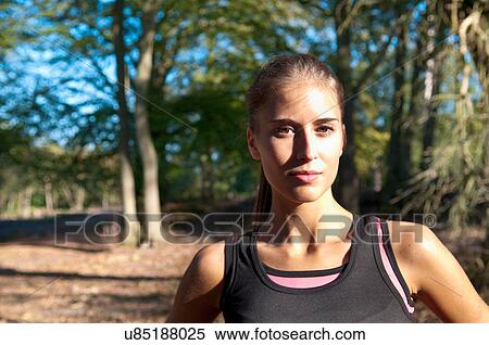 Stock Photography - Runner standing in park. Fotosearch