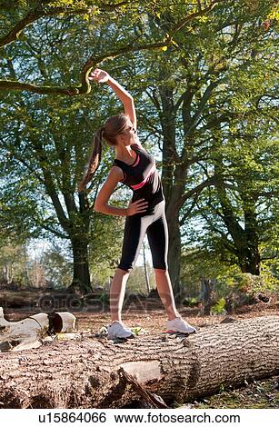 Runner stretching in park View Large Photo Image Stock Photograph - Runner stretching in park. Fotosearch