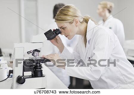 Stock Image - Scientist working in pathology lab. Fotosearch