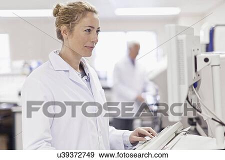 Stock Photo - Scientist working in pathology lab. Fotosearch