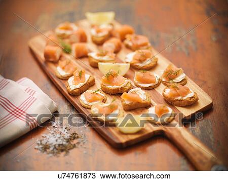 Scottish smoked salmon and cream cheese canapes on board View Large Photo Image Stock Image - Scottish smoked salmon and cream cheese canapes on board. Fotosearch