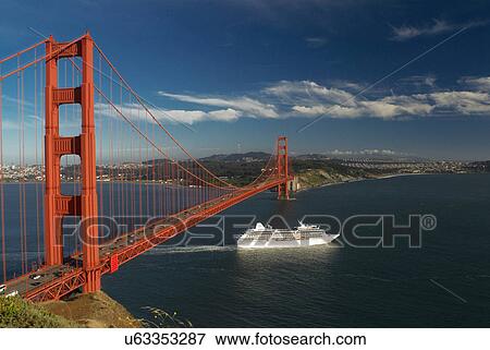 Stock Photo - Ship sailing under Golden Gate Bridge. Fotosearch