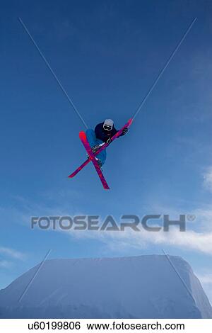 Skier crossing skis in the air View Large Photo Image Stock Photograph - Skier crossing skis in the air. Fotosearch
