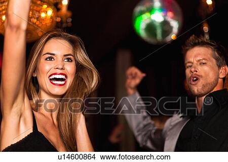 Smiling couple dancing in club View Large Photo Image Picture - Smiling couple dancing in club. Fotosearch
