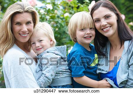 Smiling mothers holding children View Large Photo Image Stock Photo - Smiling mothers holding children. Fotosearch