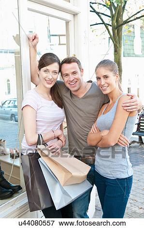 Smiling people with shopping bags View Large Photo Image Stock Photo - Smiling people with shopping bags. Fotosearch