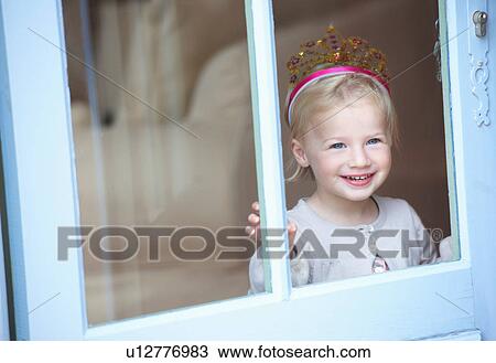 Smiling toddler girl wearing tiara View Large Photo Image Stock Image - Smiling toddler girl wearing tiara. Fotosearch
