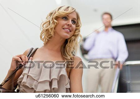 Smiling woman carrying purse View Large Photo Image Stock Image - Smiling woman carrying purse. Fotosearch