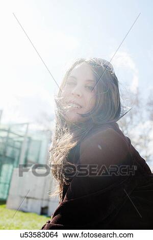 Smiling woman walking outdoors View Large Photo Image Picture - Smiling woman walking outdoors. Fotosearch
