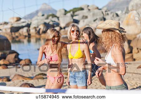 Smiling women playing beach volleyball View Large Photo Image Stock Photography - Smiling women playing beach volleyball. Fotosearch