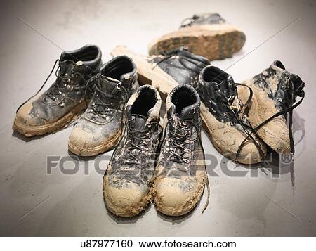 Soiled boots of workmen from a quarry View Large Photo Image Stock Image - Soiled boots of workmen from a quarry. Fotosearch