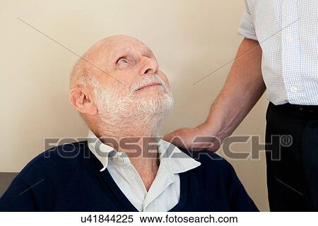 Stock Photography - Son patting father's shoulder. Fotosearch