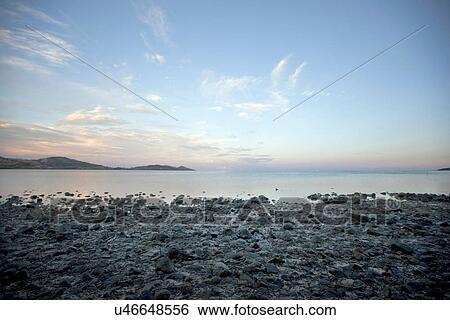 Still water on rocky beach View Large Photo Image Stock Photograph - Still water on rocky beach. Fotosearch