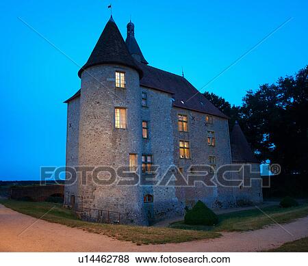 Stock Photo - Stone house lit up at night. Fotosearch