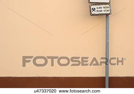 Stock Image - Street sign against wall. Fotosearch