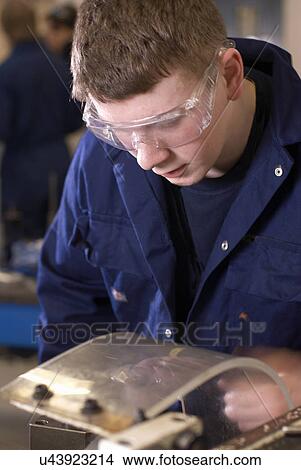 Student working on car engine View Large Photo Image Picture - Student working on car engine. Fotosearch