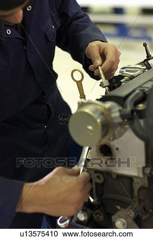 Student working on car engine View Large Photo Image Stock Image - Student working on car engine. Fotosearch